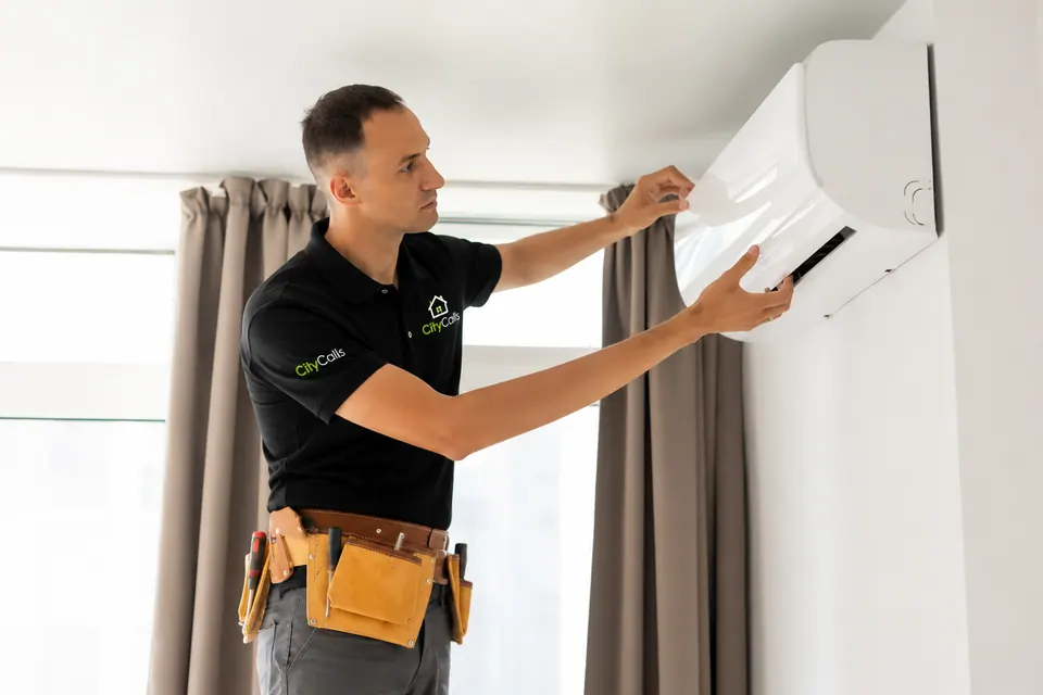 Technician servicing a split AC